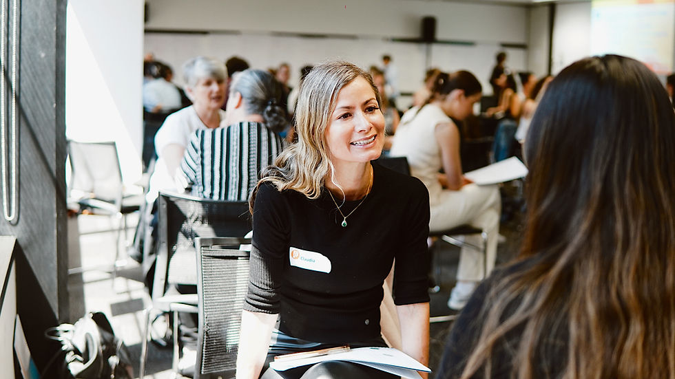 Primespeak attendee smiling and learning